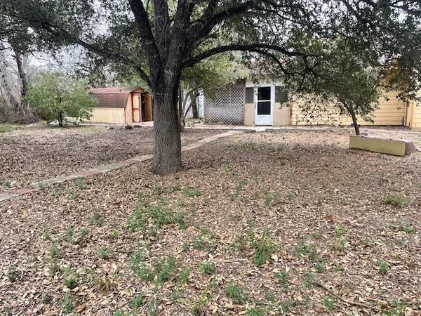 a house with trees in front of it