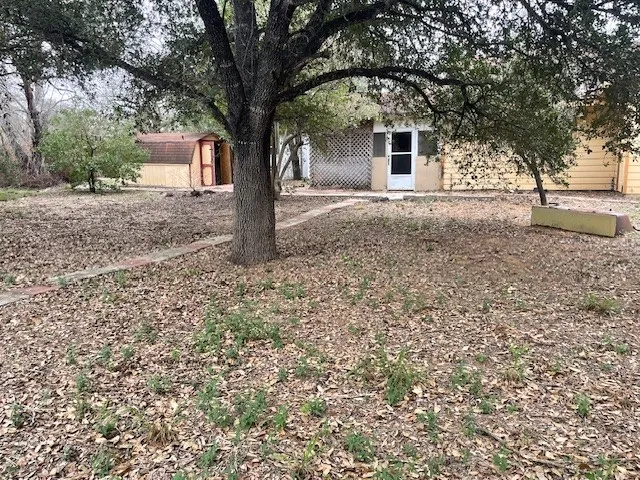 a house with trees in front of it