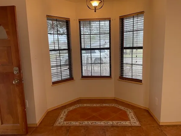 an empty room with windows