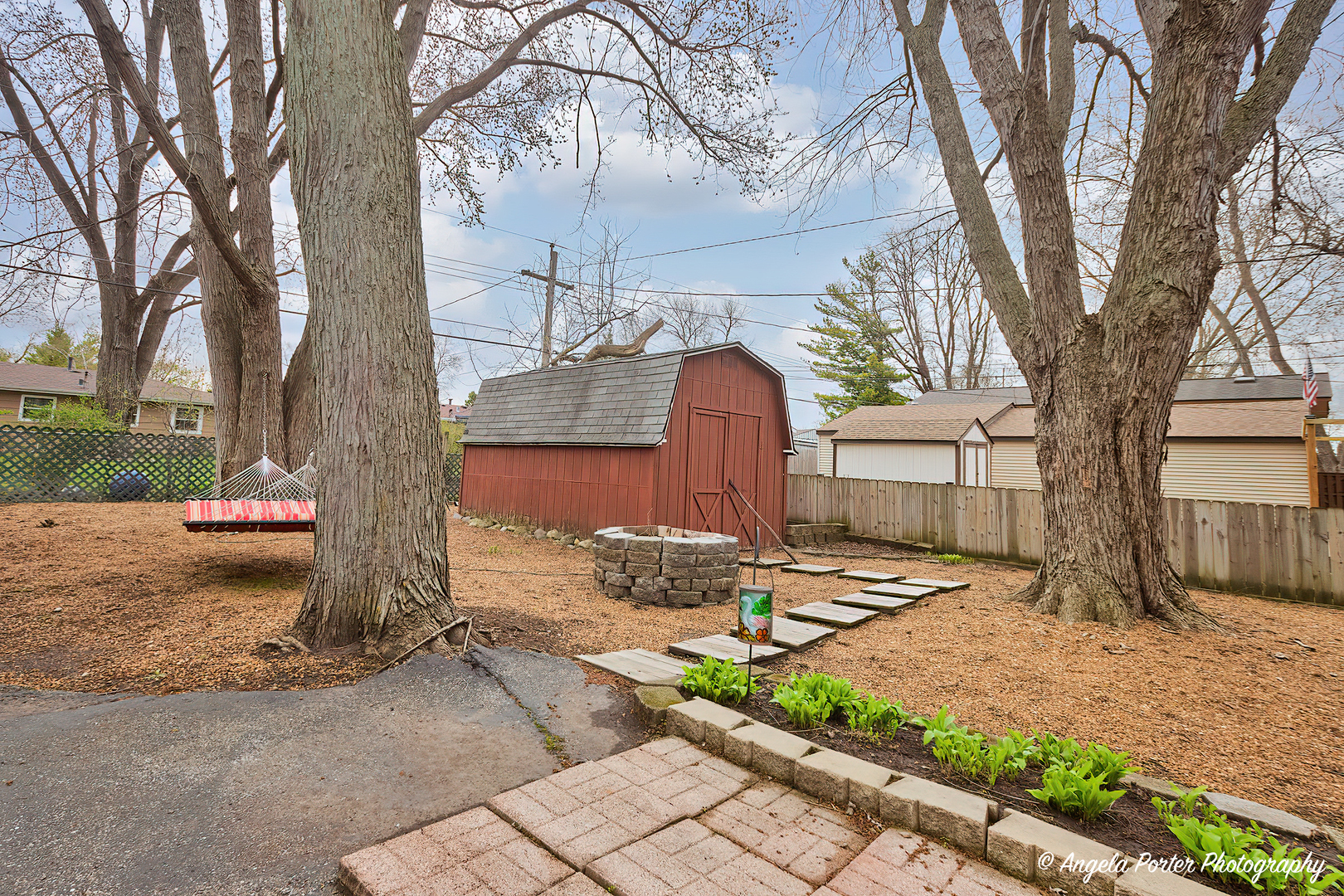 390 Willow Road Wauconda, IL 60084 - Photo 23 of 26 a front view of a house with garden