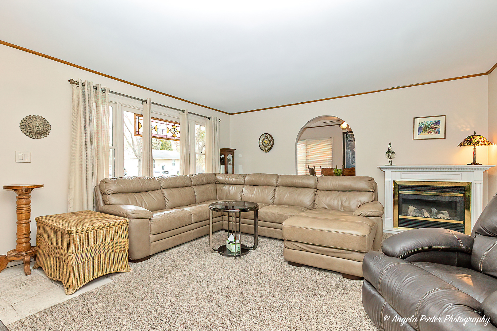 390 Willow Road Wauconda, IL 60084 - Photo 3 of 26 a living room with furniture and a fireplace