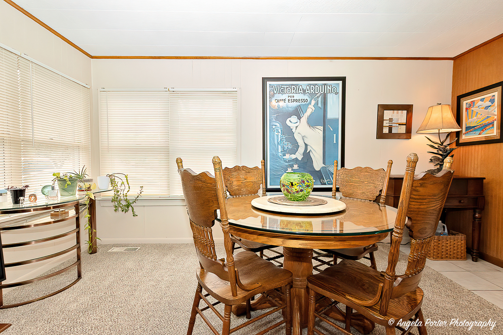 390 Willow Road Wauconda, IL 60084 - Photo 7 of 26 a view of a dining room with furniture and a potted plant