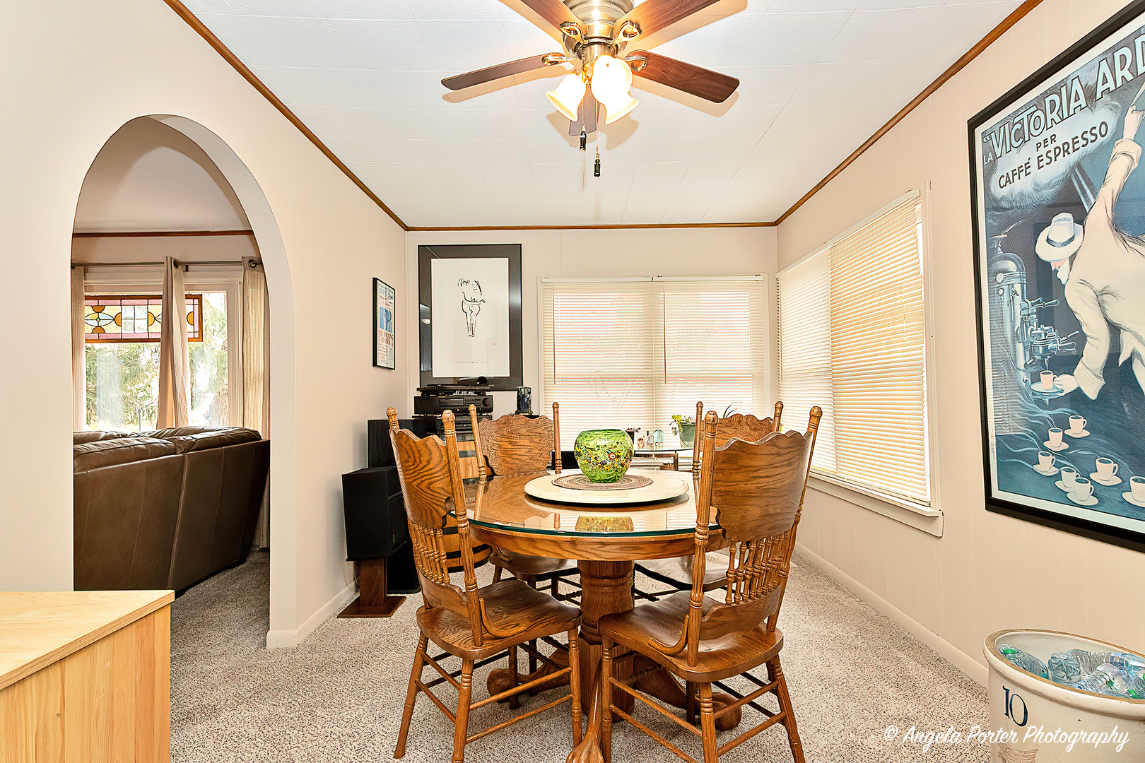 390 Willow Road Wauconda, IL 60084 - Photo 8 of 26 a dining room with furniture a window and a chandelier