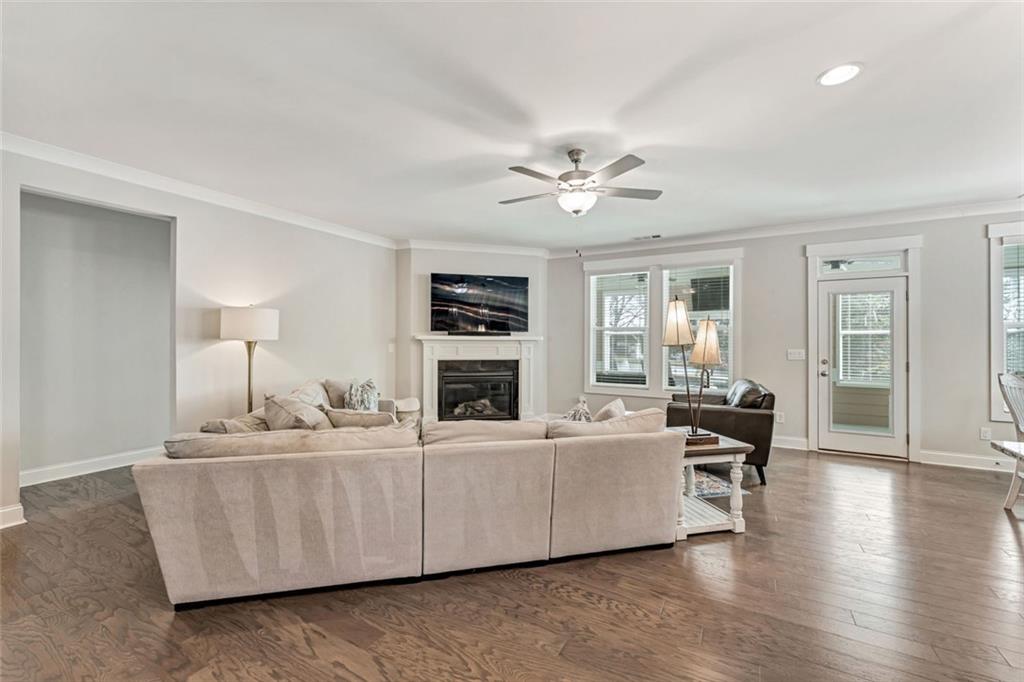 920 Traditions Way Jefferson, GA 30549 - Photo 14 of 40 a living room with furniture and a wooden floor