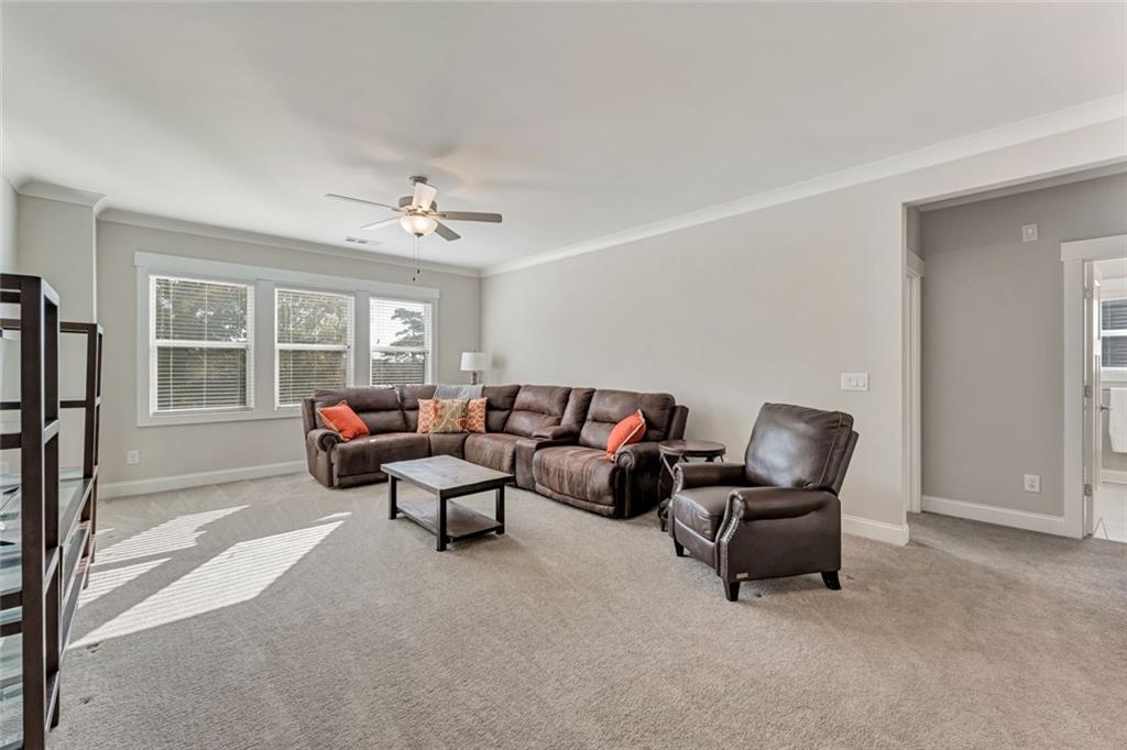 920 Traditions Way Jefferson, GA 30549 - Photo 23 of 40 a living room with furniture and a window