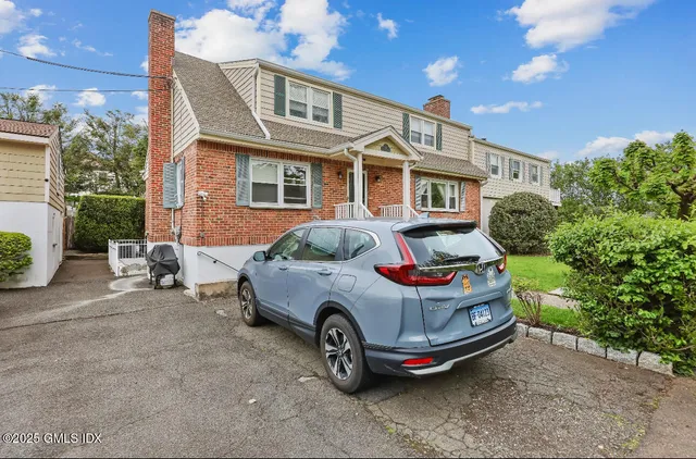 a car parked in front of a house