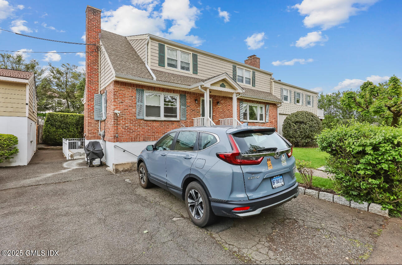 54 Rodwell Avenue, Unit 1 Greenwich, CT 06830 - Photo 2 of 14 a car parked in front of a house