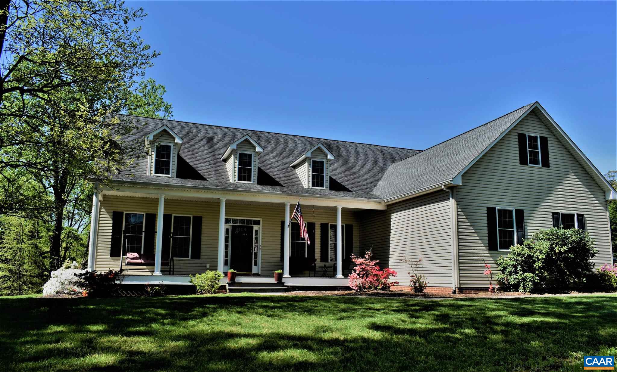 1333 Middle River Road Stanardsville, VA 22973 - Photo 1 of 31 a front view of a house with a yard