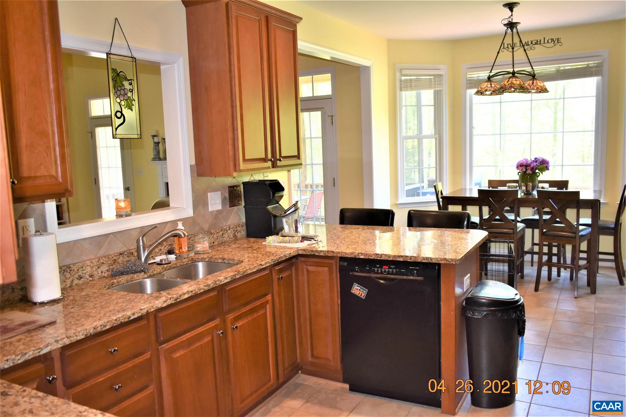 1333 Middle River Road Stanardsville, VA 22973 - Photo 14 of 31 a kitchen with stainless steel appliances a sink stove and cabinets