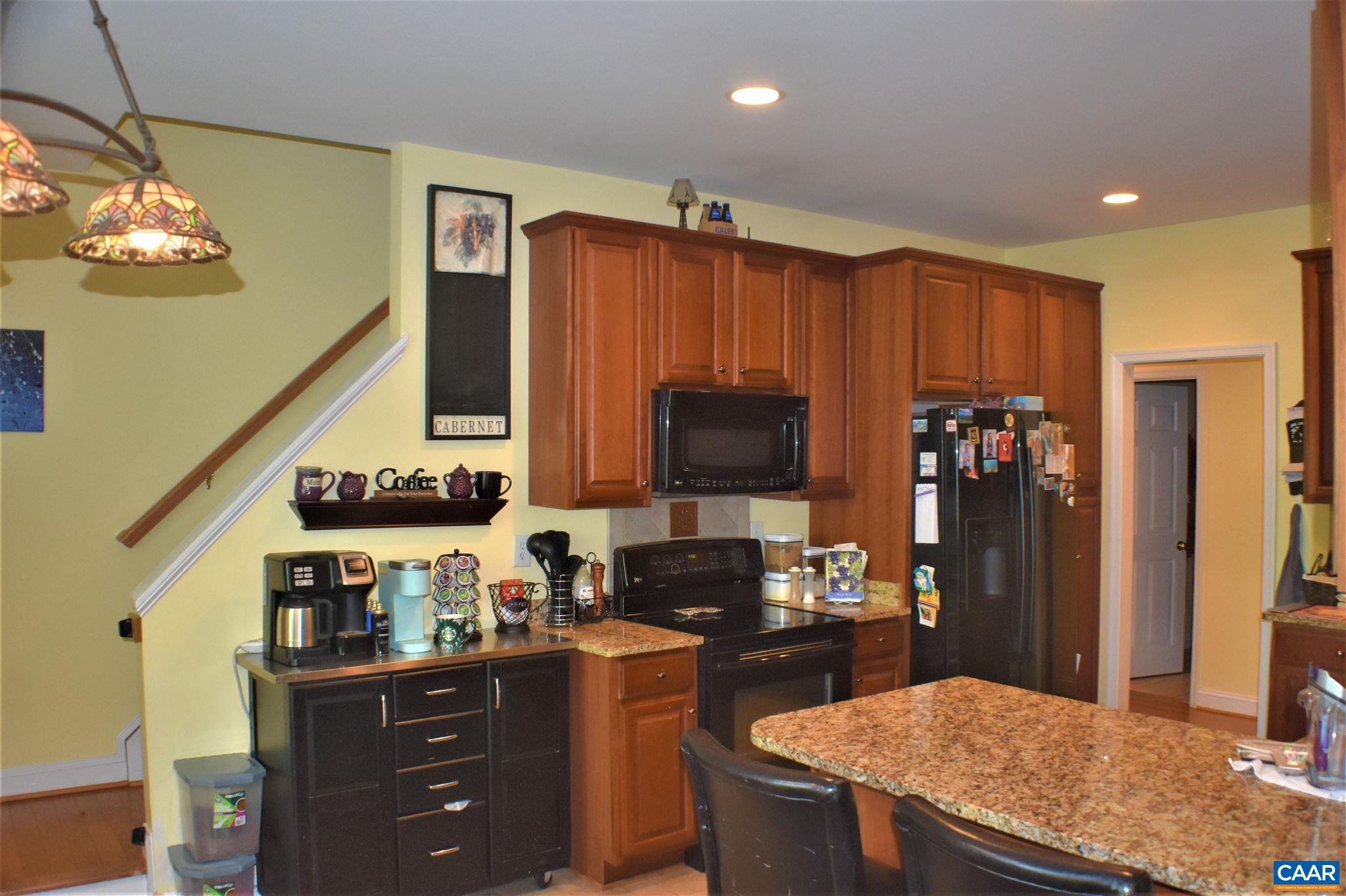 1333 Middle River Road Stanardsville, VA 22973 - Photo 15 of 31 a kitchen with granite countertop a refrigerator stove top oven and sink