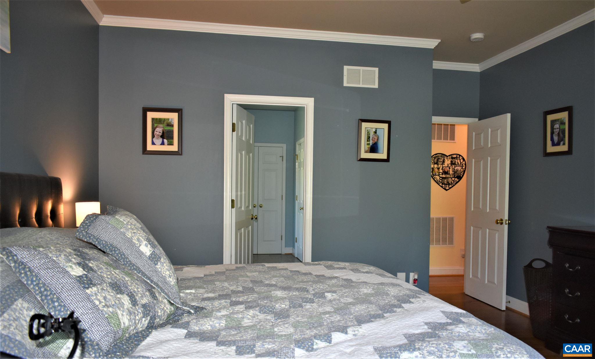 1333 Middle River Road Stanardsville, VA 22973 - Photo 16 of 31 a bedroom with a bed and a lamp on dresser