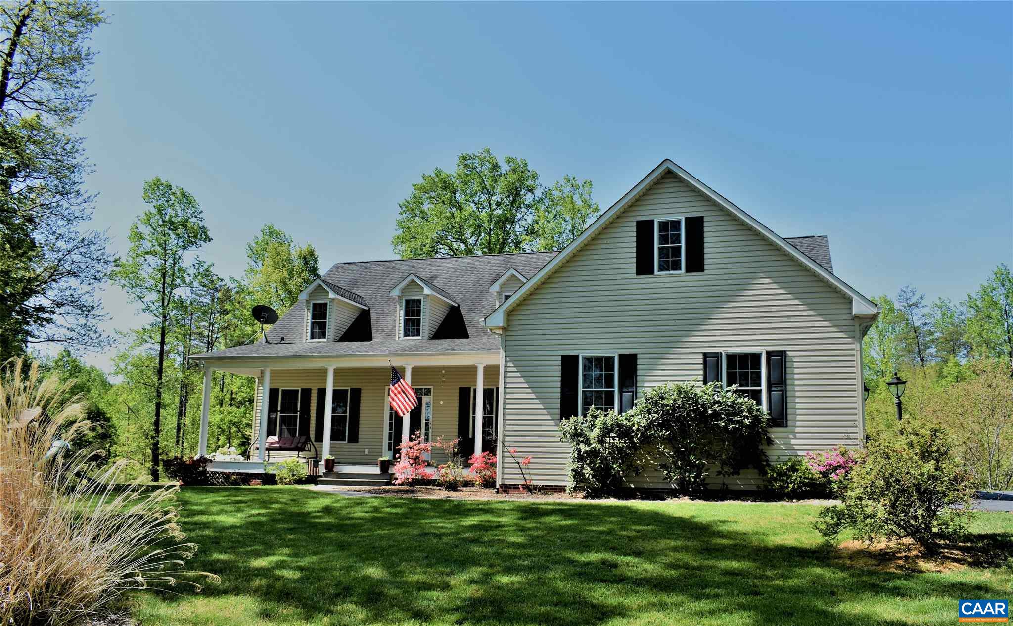 1333 Middle River Road Stanardsville, VA 22973 - Photo 2 of 31 a front view of a house with a yard and porch