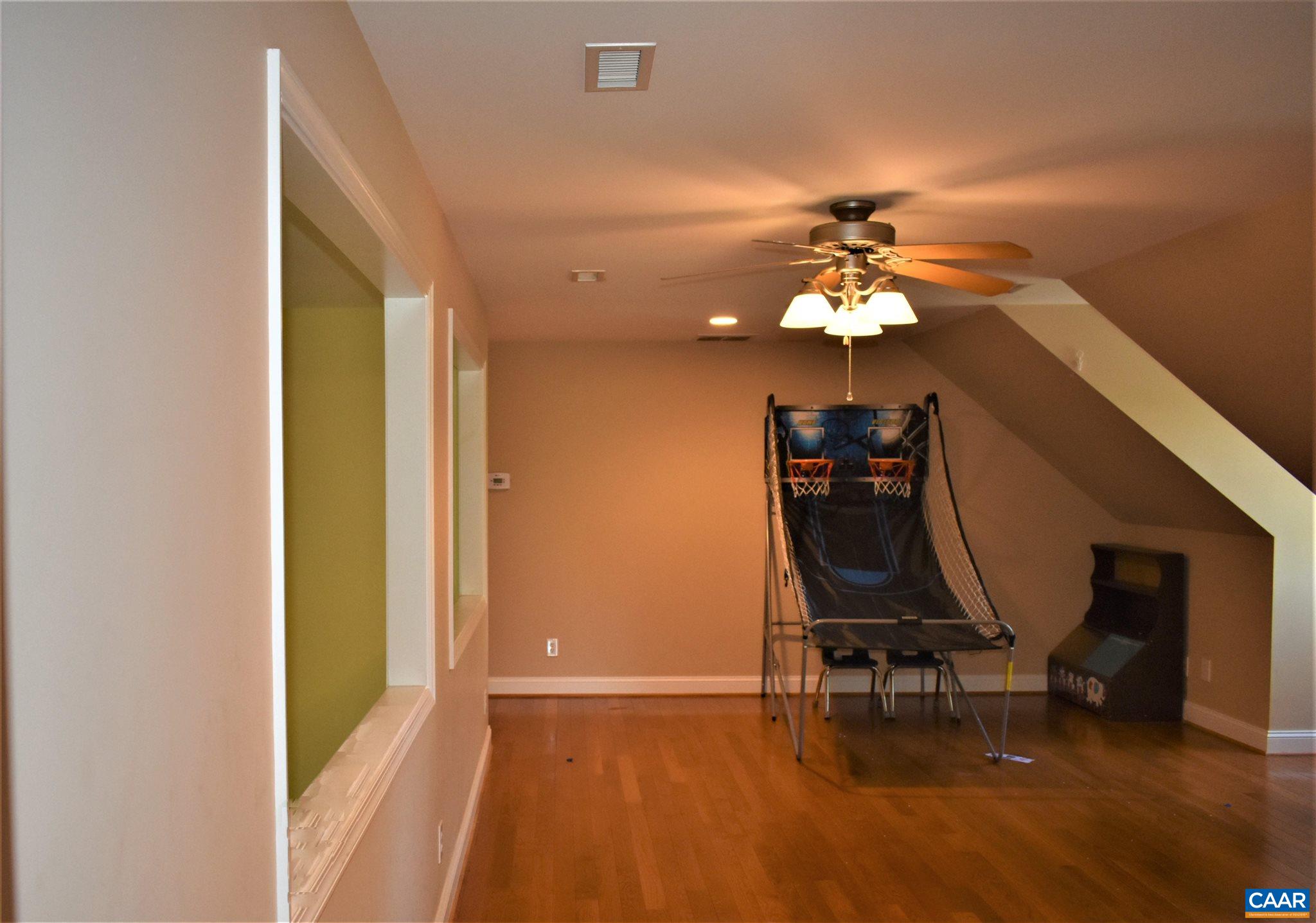 1333 Middle River Road Stanardsville, VA 22973 - Photo 23 of 31 a view of a workspace with furniture and a chandelier