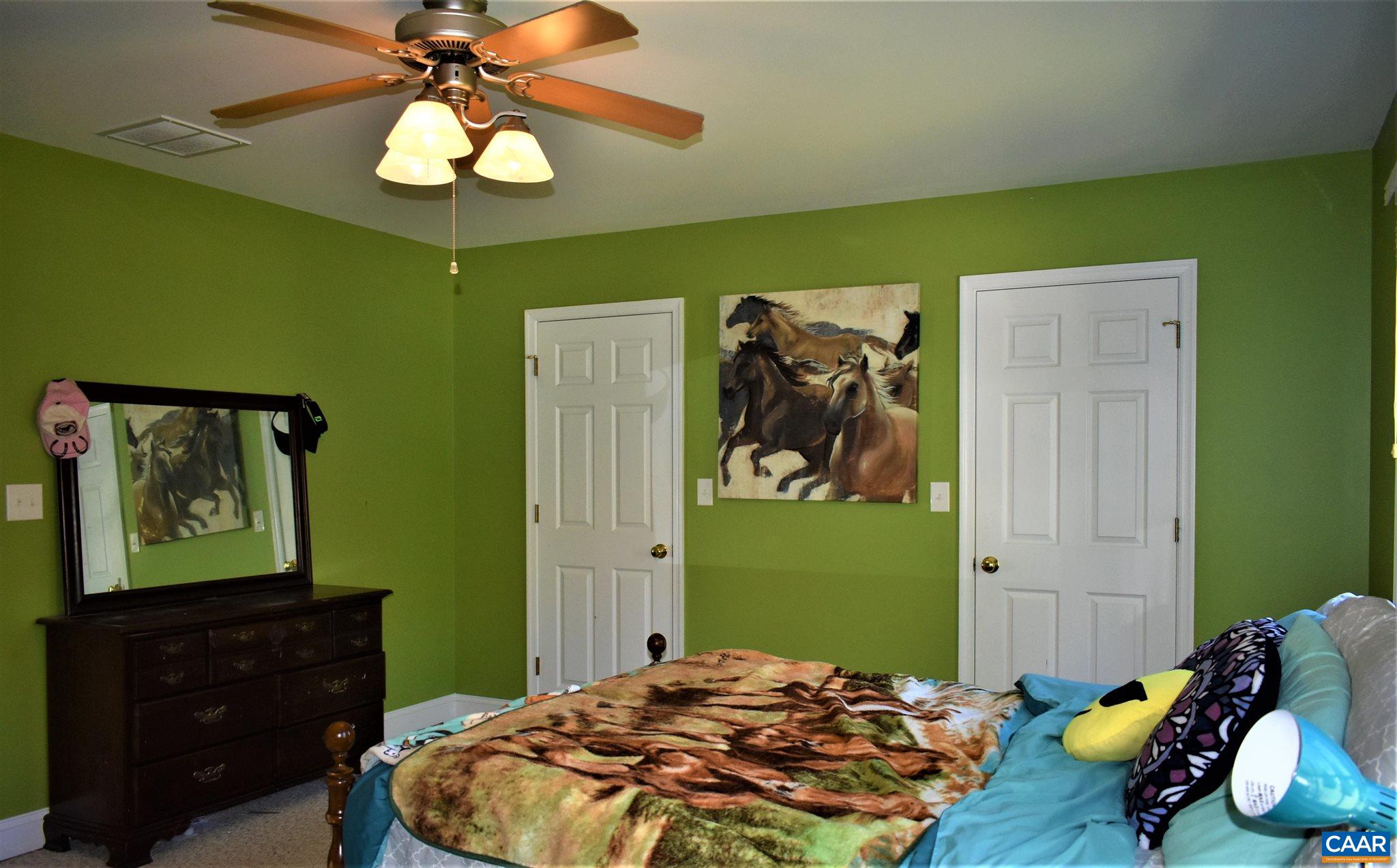 1333 Middle River Road Stanardsville, VA 22973 - Photo 24 of 31 a bedroom with a bed and a dresser