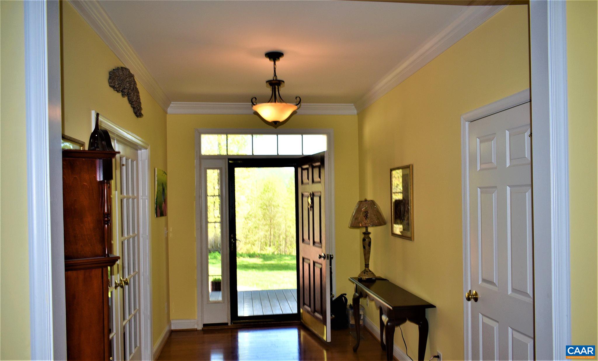 1333 Middle River Road Stanardsville, VA 22973 - Photo 26 of 31 a view of a hallway with wooden floor and windows