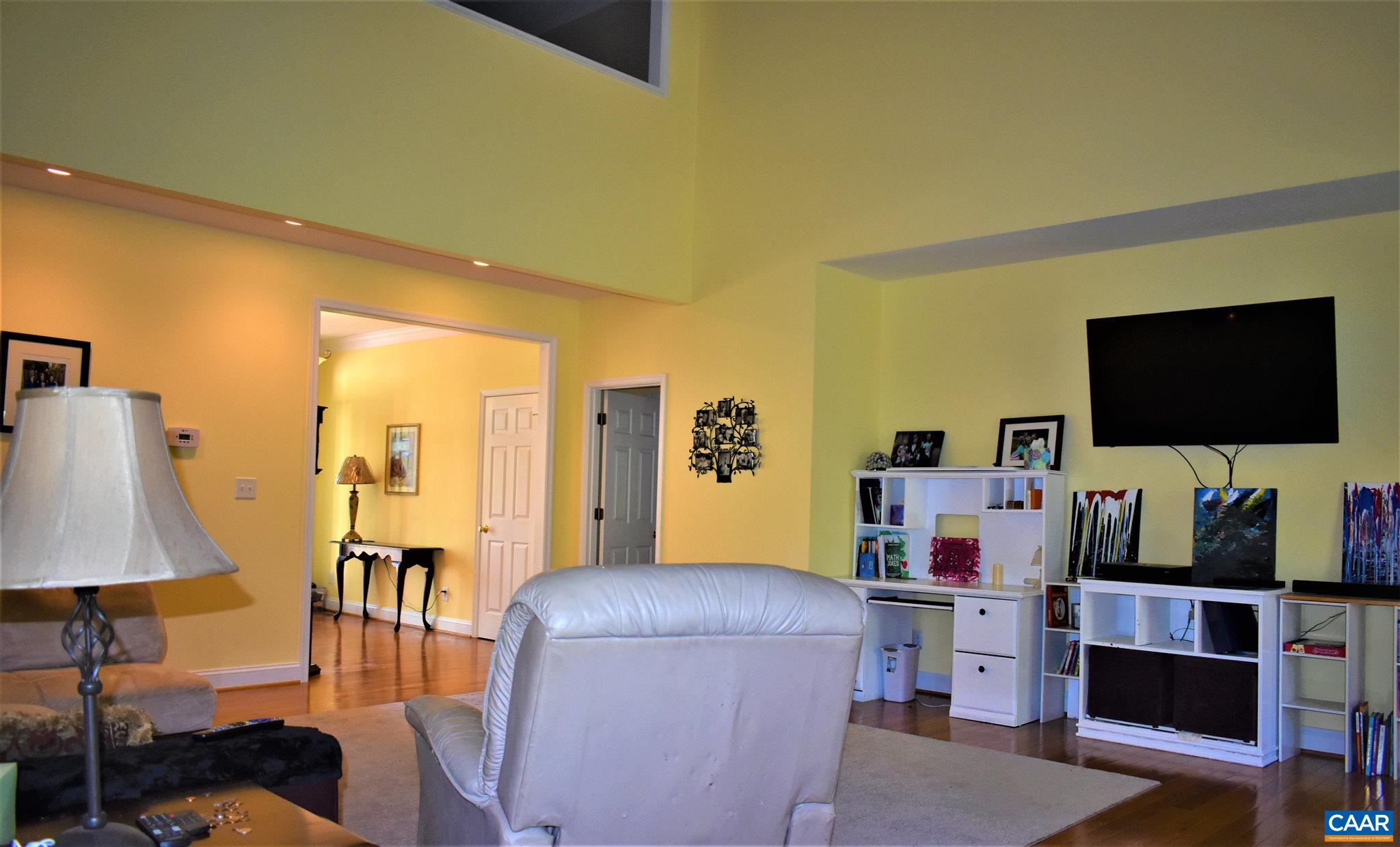 1333 Middle River Road Stanardsville, VA 22973 - Photo 8 of 31 a living room with furniture and a flat screen tv