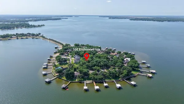 an aerial view of a house having yard lake lake and mountain view