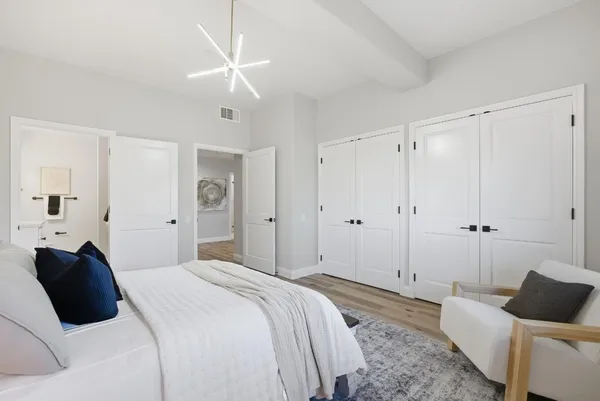 a bedroom with a bed and a couch