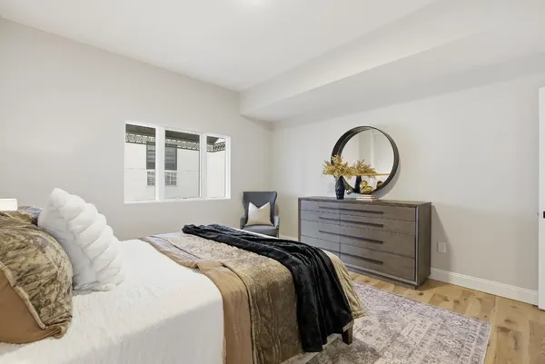a bed room with a bed and a window
