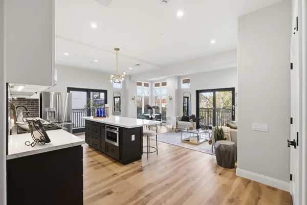 a living room with furniture window and wooden floor