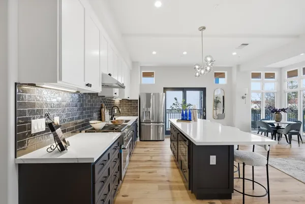 a kitchen with counter space sink stove and refrigerator
