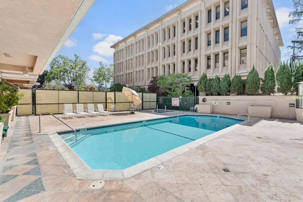a view of a swimming pool with a patio