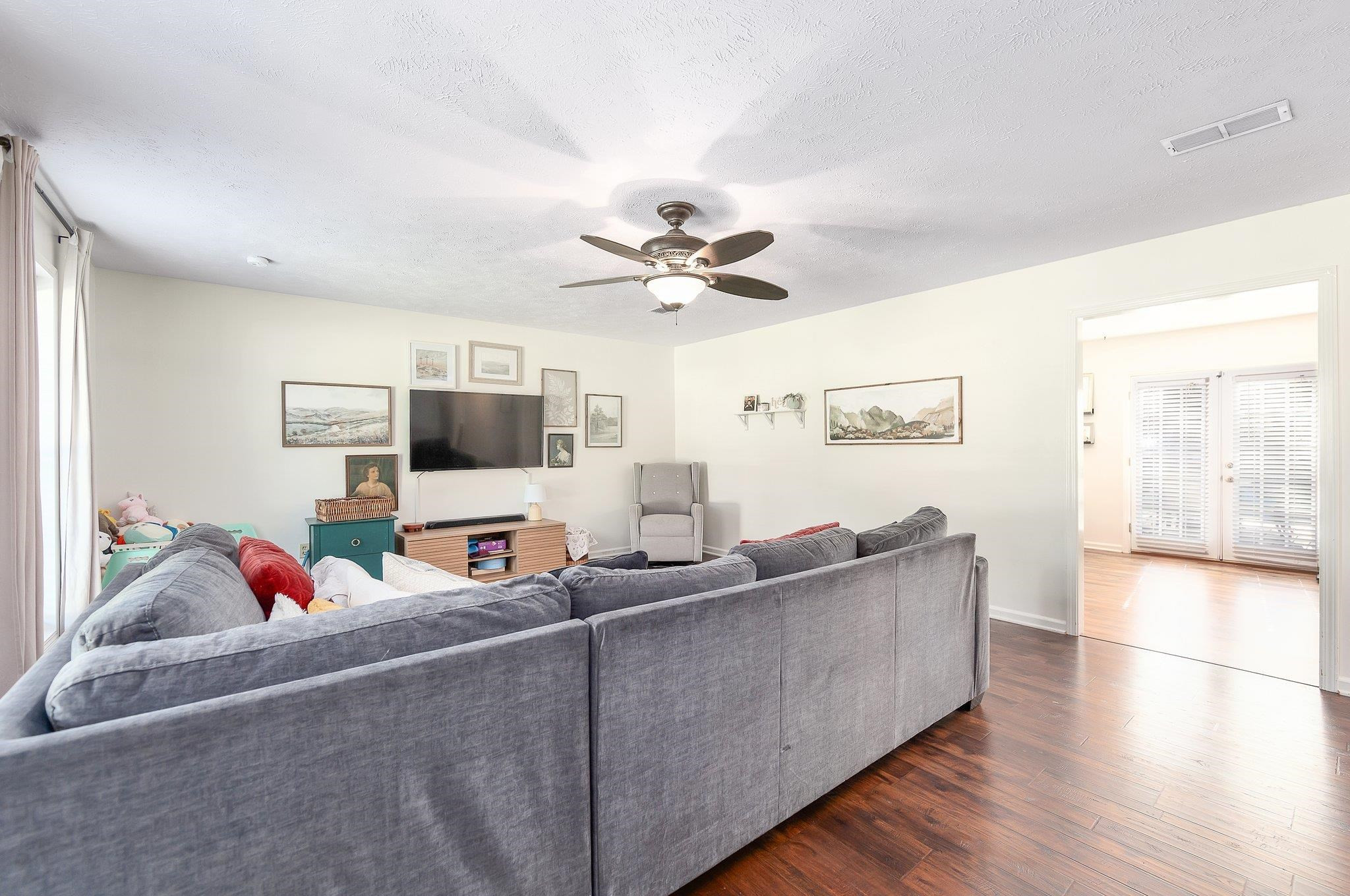46 Commanche Cove Jackson, TN 38305 - Photo 12 of 29 a living room with furniture and a flat screen tv