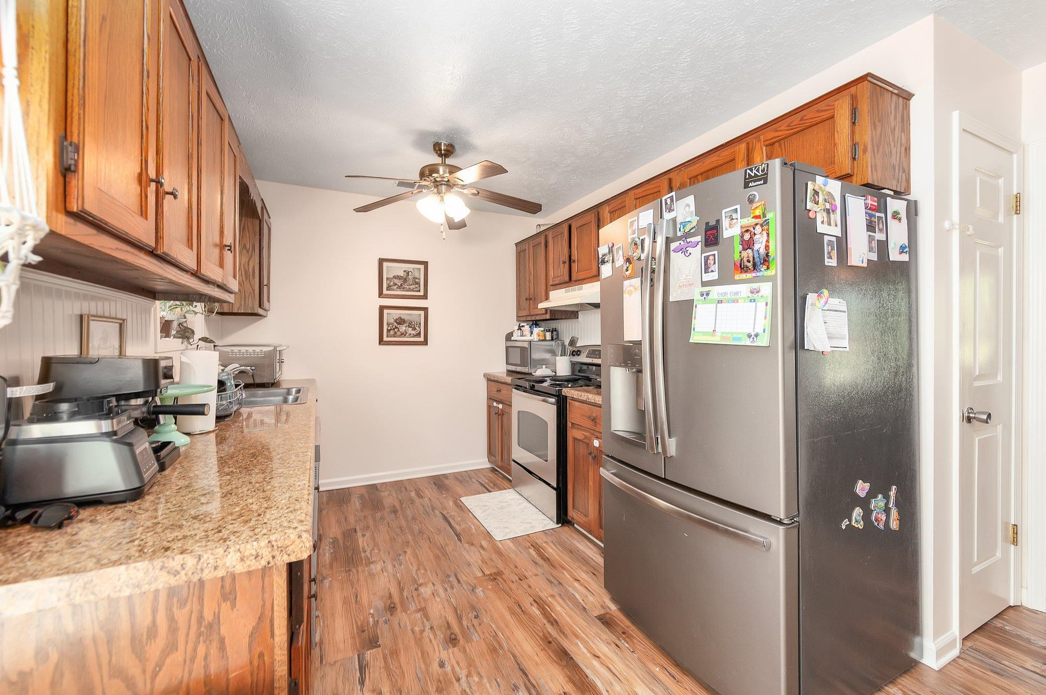 46 Commanche Cove Jackson, TN 38305 - Photo 15 of 29 a kitchen with stainless steel appliances granite countertop a refrigerator a stove and a sink