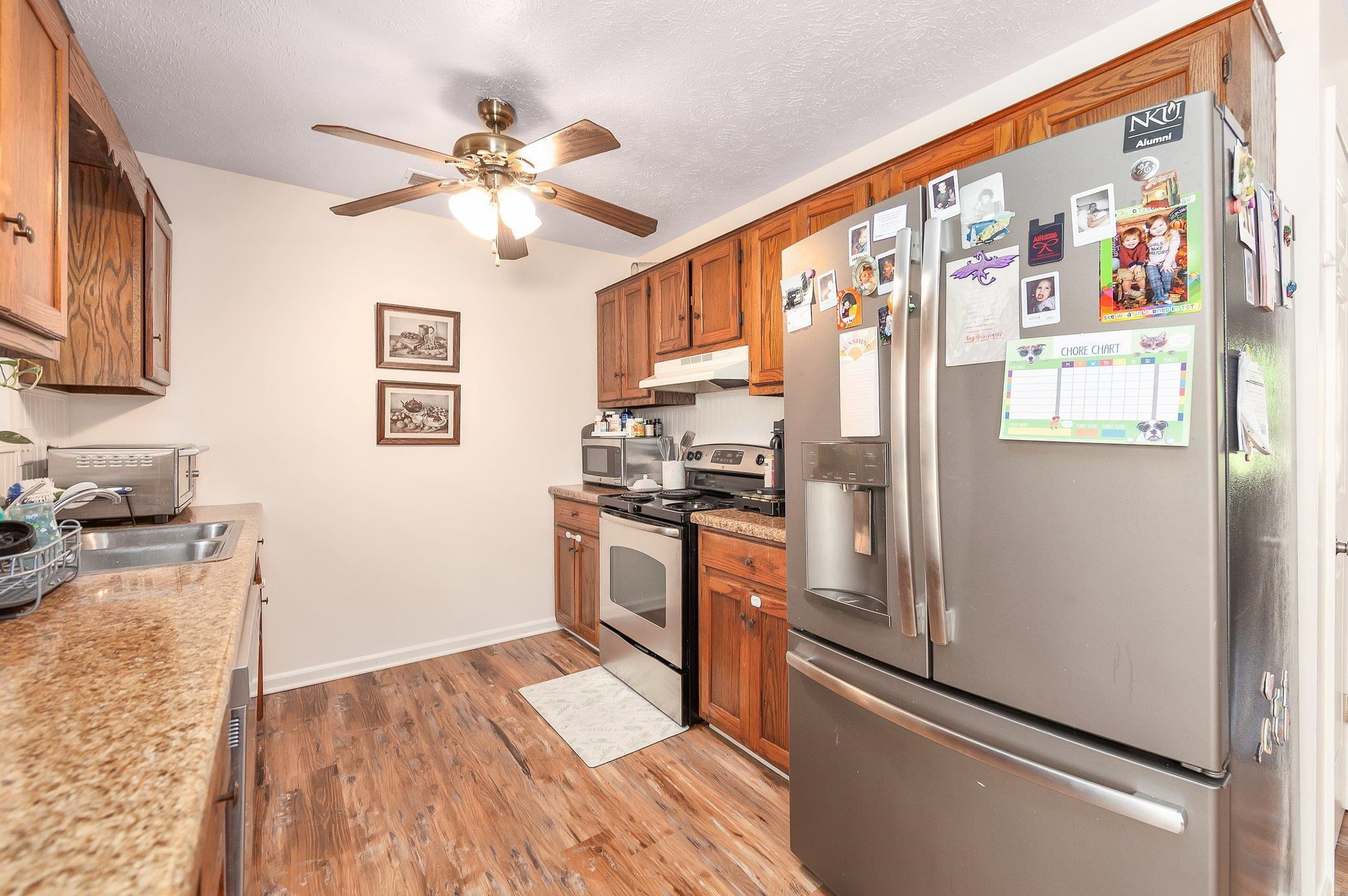 46 Commanche Cove Jackson, TN 38305 - Photo 16 of 29 a kitchen with stainless steel appliances a refrigerator and a stove top oven