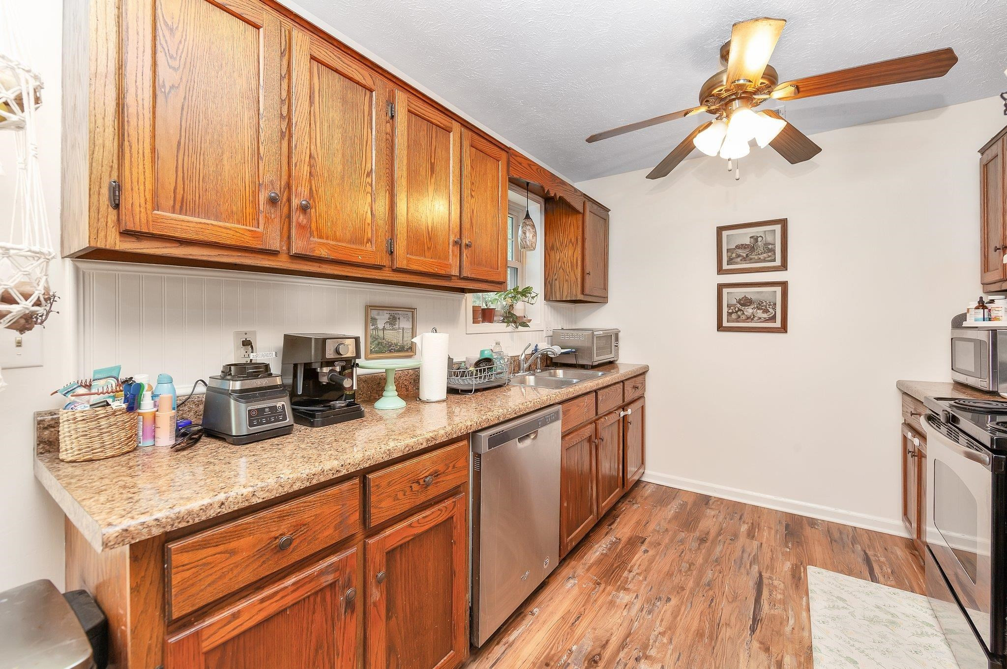 46 Commanche Cove Jackson, TN 38305 - Photo 17 of 29 a kitchen with granite countertop cabinets stainless steel appliances and a counter space
