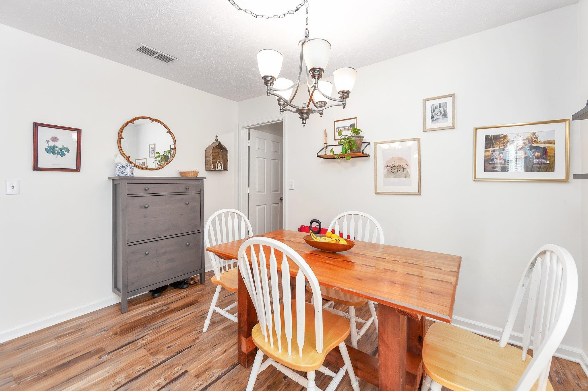 46 Commanche Cove Jackson, TN 38305 - Photo 18 of 29 a view of a dining room with furniture wooden floor and a chandelier