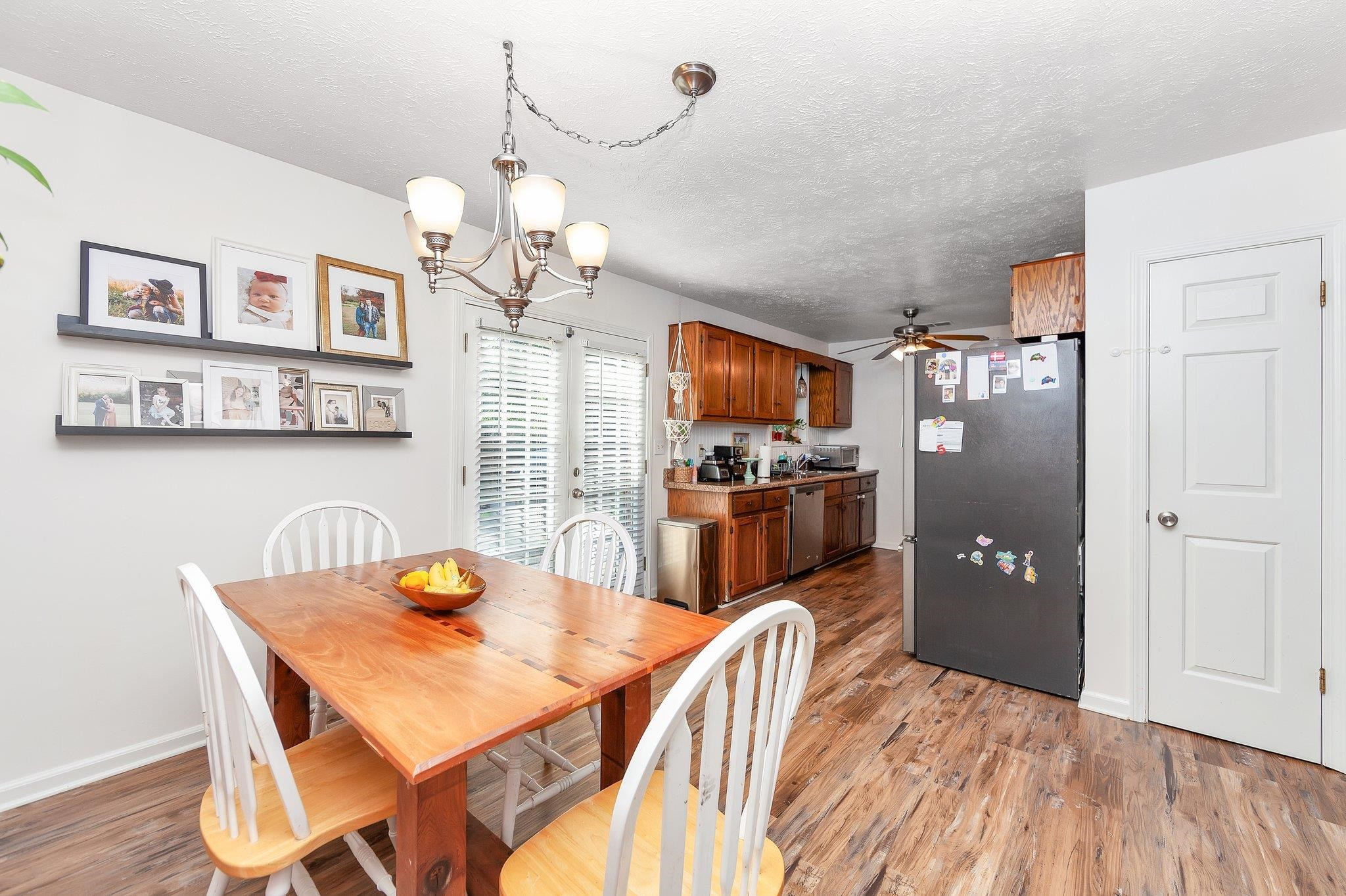 46 Commanche Cove Jackson, TN 38305 - Photo 20 of 29 a kitchen with stainless steel appliances granite countertop a dining table chairs refrigerator and cabinets
