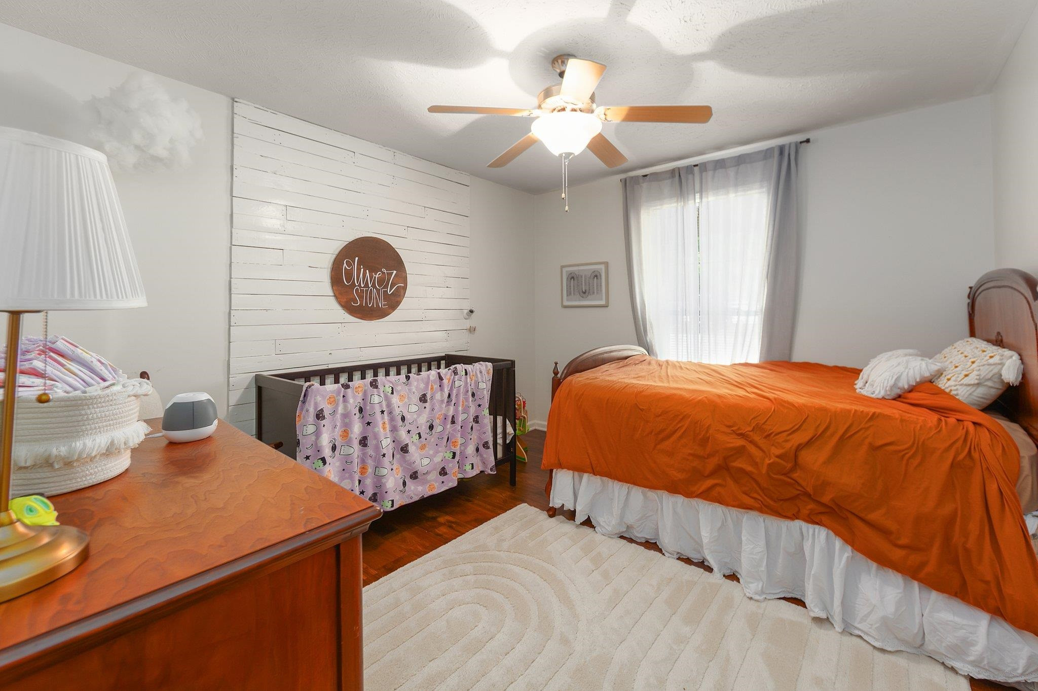 46 Commanche Cove Jackson, TN 38305 - Photo 27 of 29 a bedroom with a bed and a chandelier