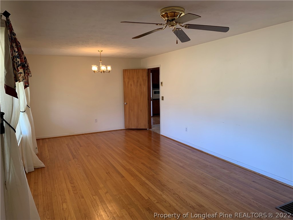 7114 Clinton Road Stedman, NC 28391 - Photo 7 of 34 a view of an empty room with a window