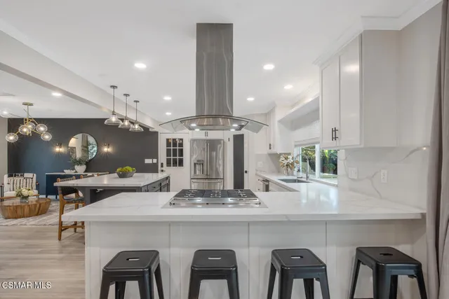 a kitchen with a table and chairs in it