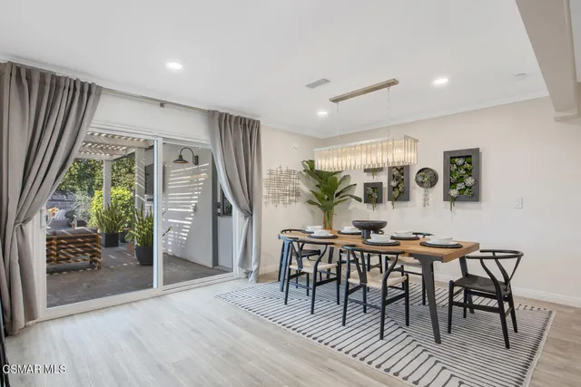 a view of a dining room with furniture and window
