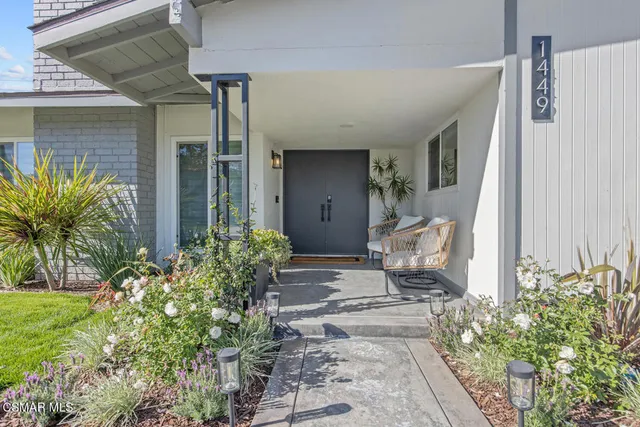 a front view of a house with garden