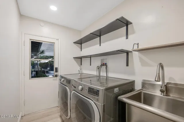 a kitchen with a sink and a refrigerator