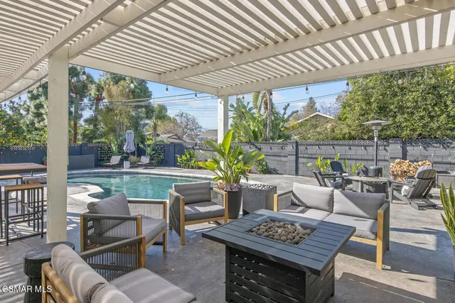 a outdoor space with patio the couches and a dining table with garden view