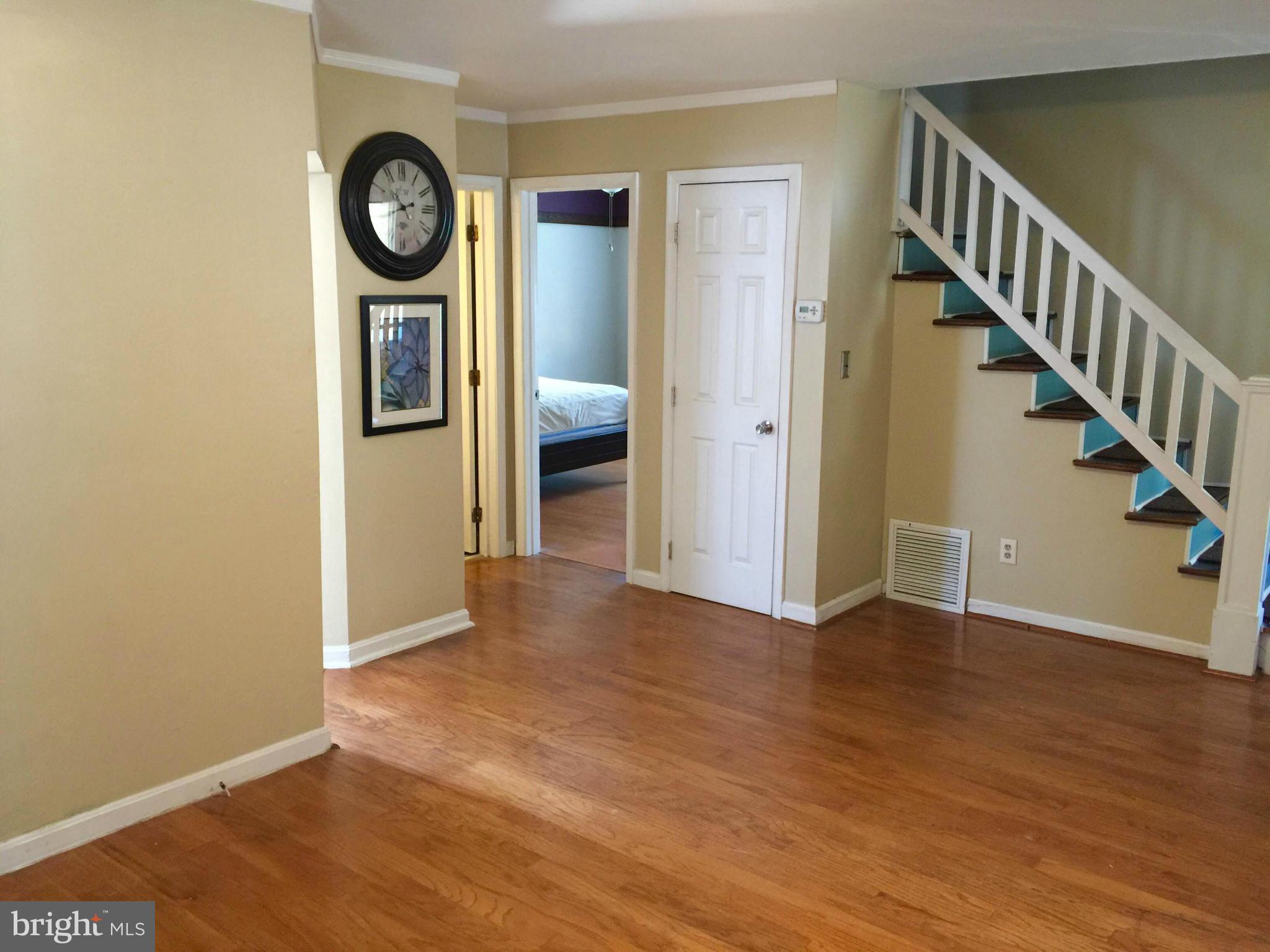 8 Ridgemoor Road Baltimore, MD 21221 - Photo 3 of 13 a view of a hallway with wooden floor
