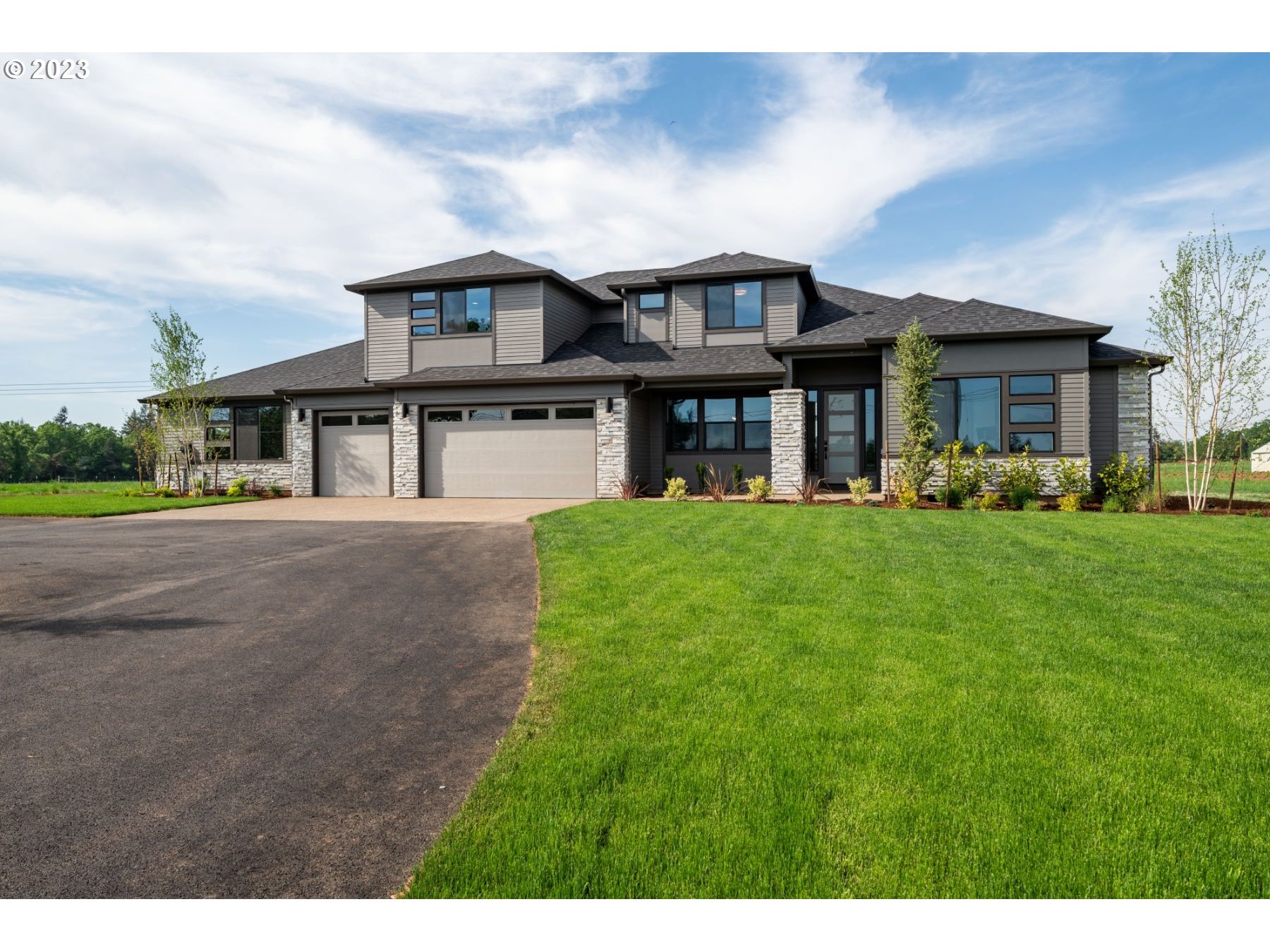 a front view of a house with a yard