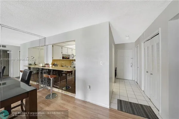 a view of a kitchen and dining room