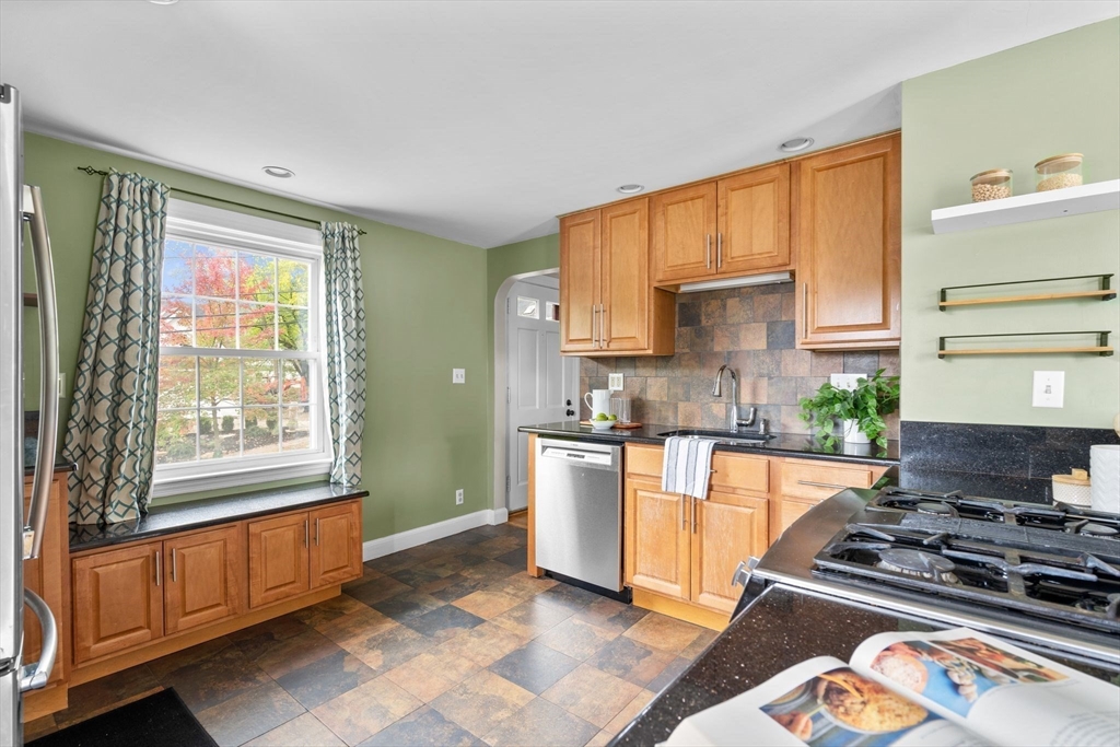 29 Walnut Terrace Arlington, MA 02476 - Photo 13 of 41 a kitchen with stainless steel appliances granite countertop a stove a sink and a refrigerator