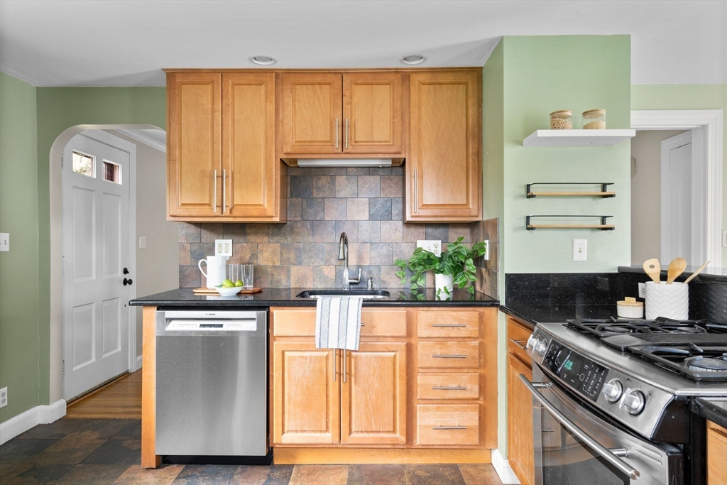 29 Walnut Terrace Arlington, MA 02476 - Photo 14 of 41 a kitchen with granite countertop cabinets stainless steel appliances and a counter space
