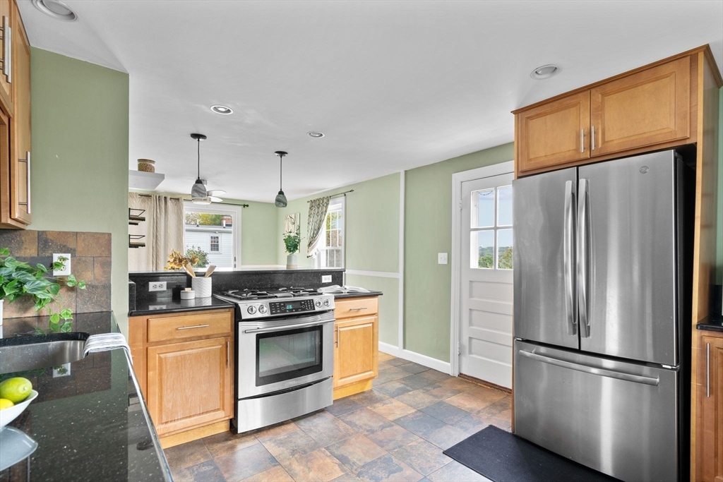 29 Walnut Terrace Arlington, MA 02476 - Photo 16 of 41 a kitchen with stainless steel appliances a stove a refrigerator and a refrigerator