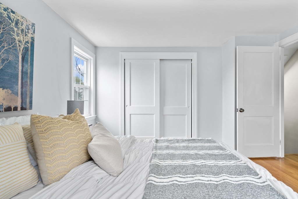 29 Walnut Terrace Arlington, MA 02476 - Photo 20 of 41 a bedroom with a bed and a couch
