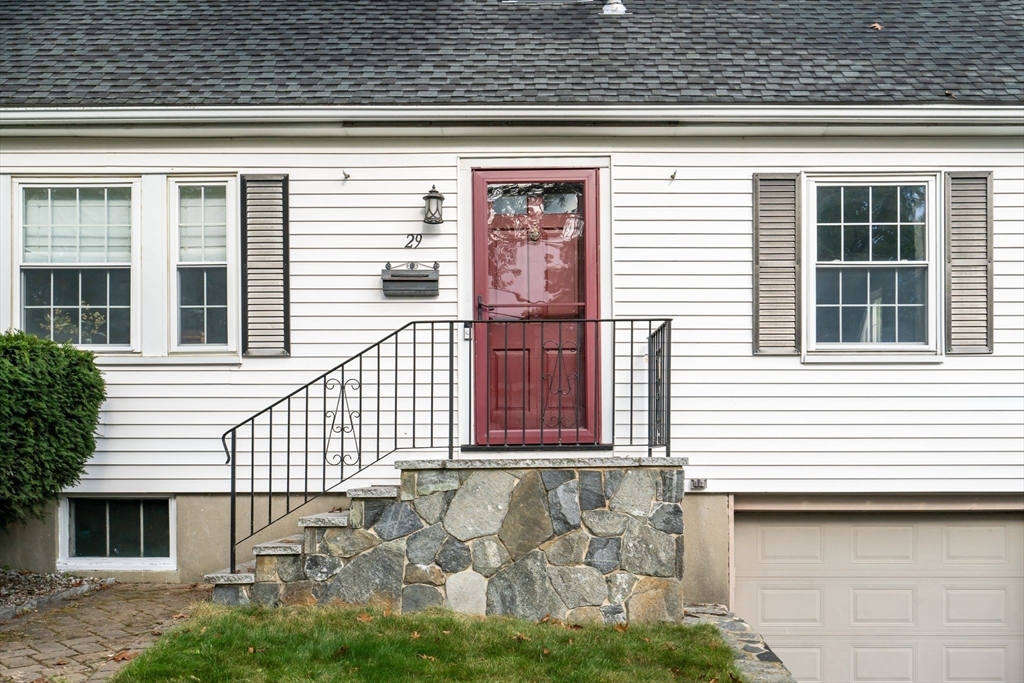 29 Walnut Terrace Arlington, MA 02476 - Photo 2 of 41 a front view of a house with a garden
