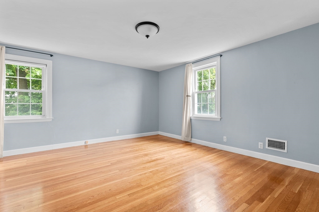 29 Walnut Terrace Arlington, MA 02476 - Photo 23 of 41 a view of an empty room with wooden floor and a window