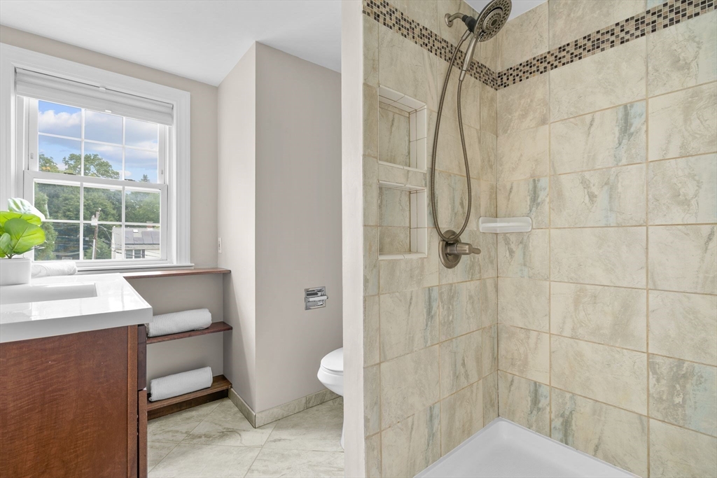 29 Walnut Terrace Arlington, MA 02476 - Photo 31 of 41 a bathroom with a sink toilet and shower