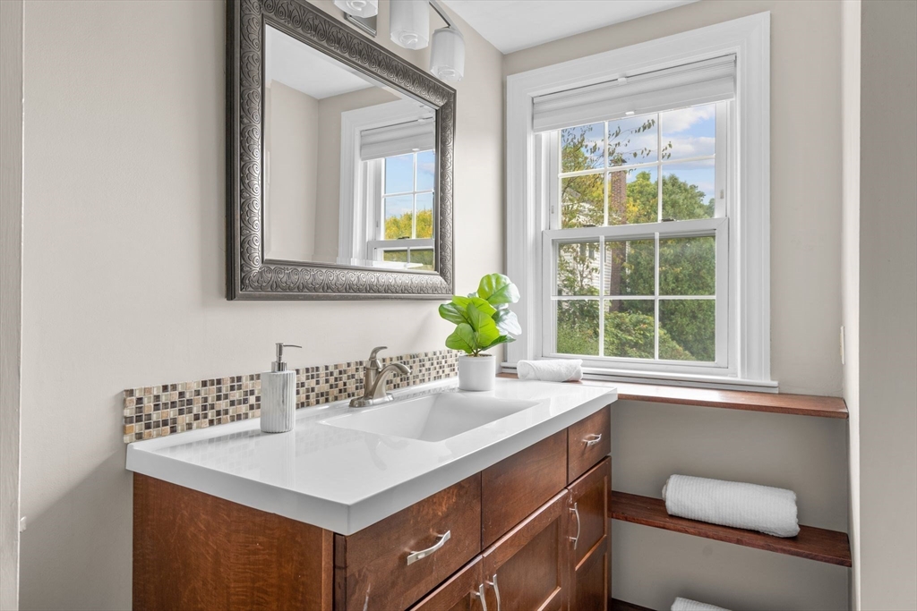 29 Walnut Terrace Arlington, MA 02476 - Photo 32 of 41 a bathroom with a sink a toilet and a window